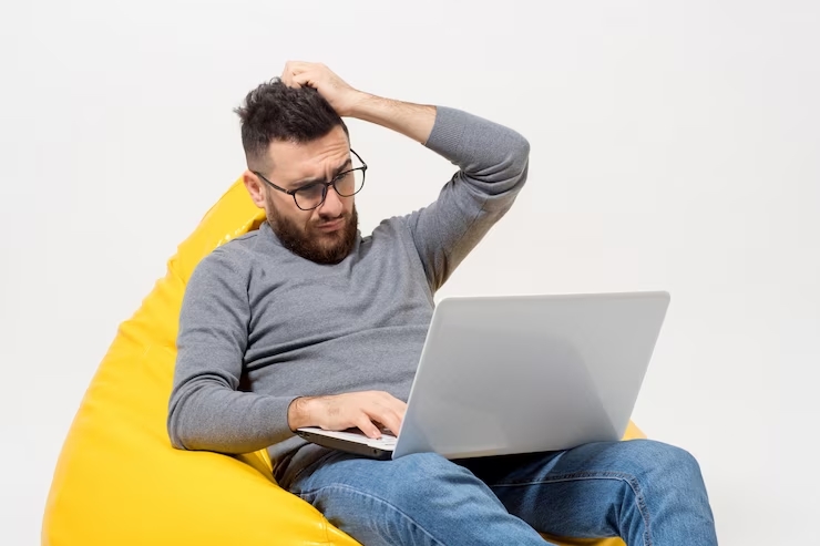 https://www.freepik.com/free-photo/guy-frustrated-while-sitting-yellow-pouf-chair_7608090.htm#query=pusing%20laptop&position=1&from_view=search&track=ais 